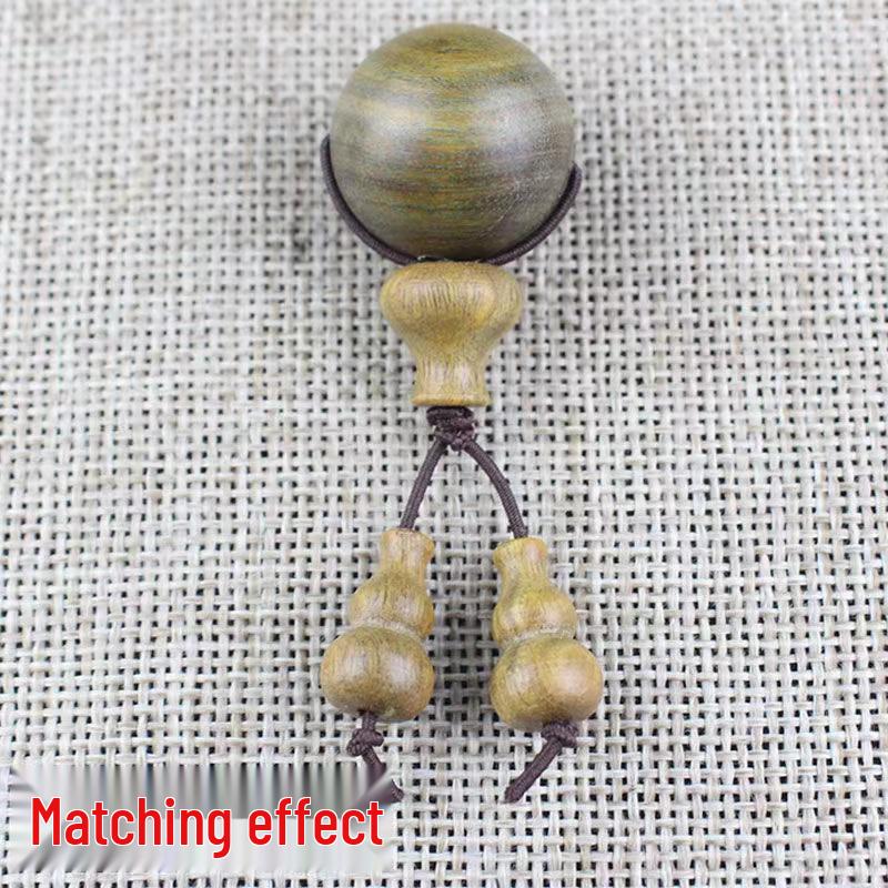 Armband aus grübem Ebenholz und rotem Sandelholz mit Buddha-Kopf, Kürbisanhänger und Vajra Bodhi-Accessoires.