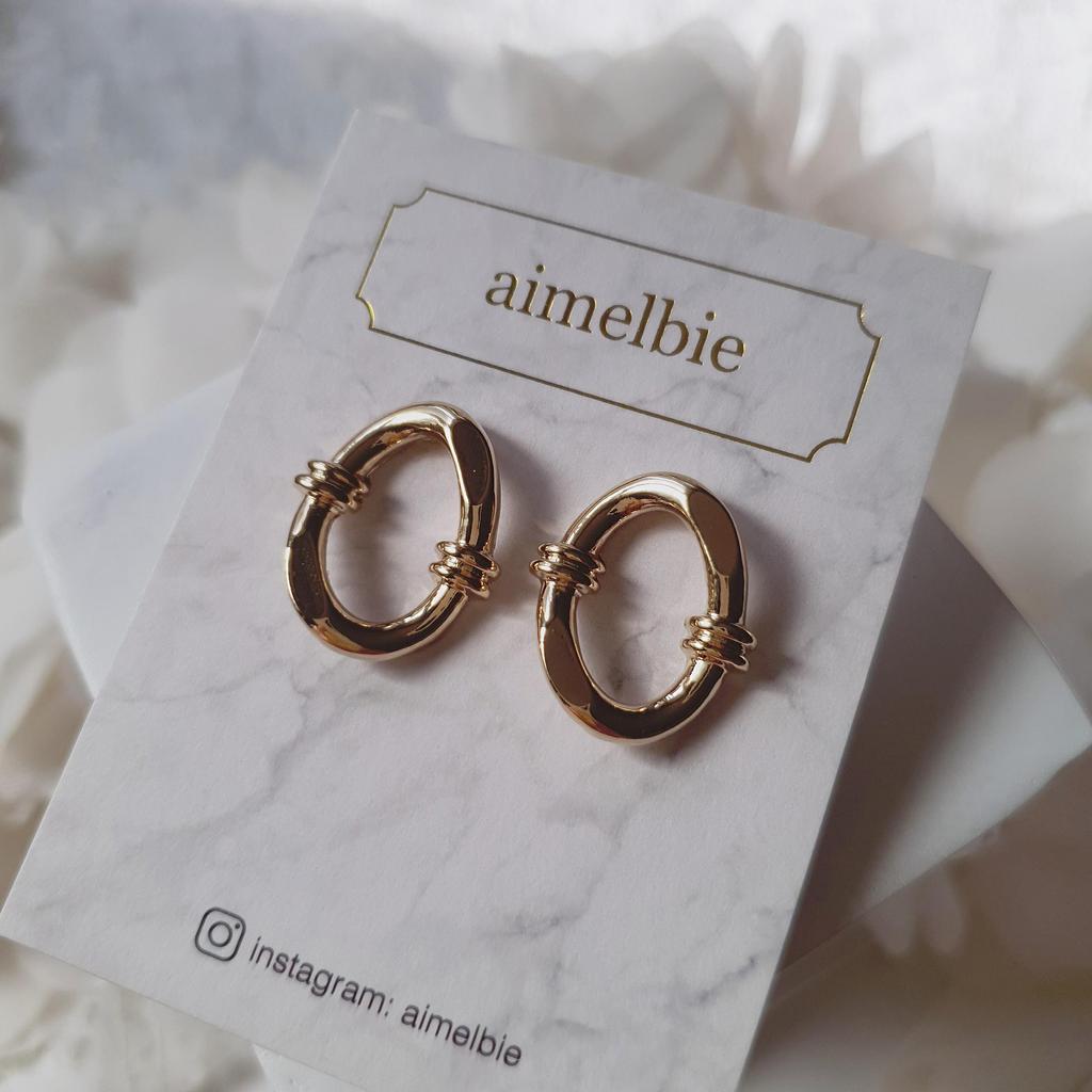 Geknotete ovale Ringohrringe - Goldfarben