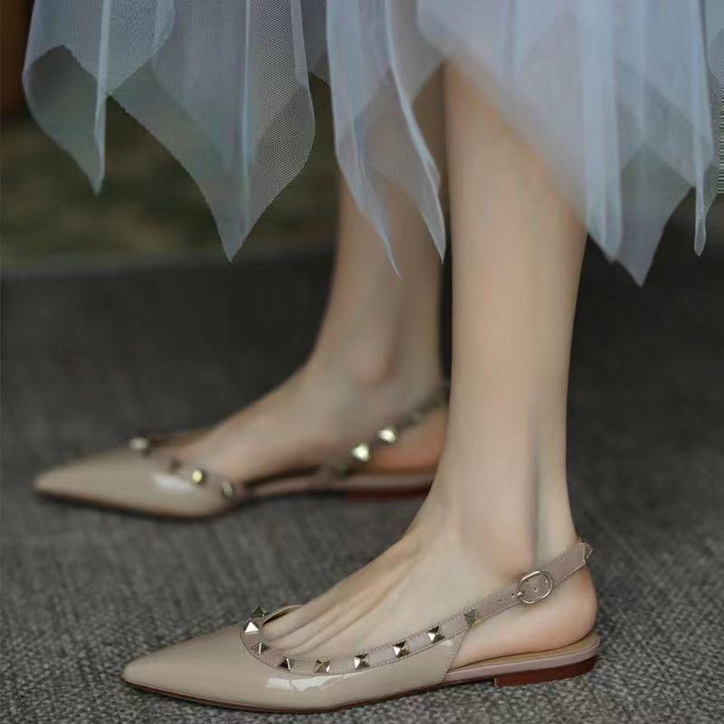Pointed toe bag head sandals women's 2025 spring new patent leather nude rivet shoes flat sexy single shoes ins tide
