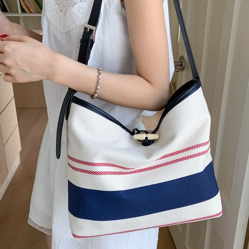 Niche High-value Handbag Small Bag Women's 2025 New Striped Canvas Bag Fashionable Shoulder Crossbody Bucket Bag