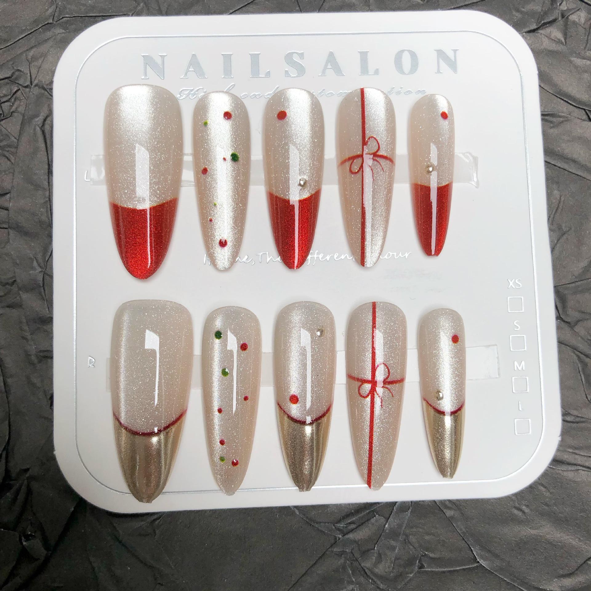 

New Year Red Almond Cat Eye Nails with Magic Mirror Finish and Crystal Stones