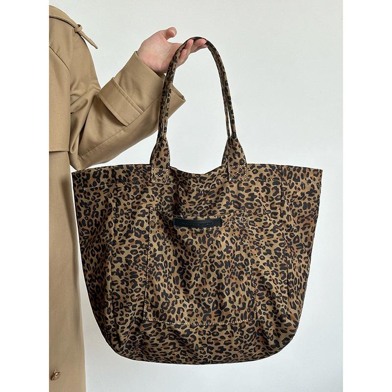 

Холщовая сумка с леопардовым принтом в стиле ретро для женщин 2024 года, новый дизайн в стиле ленивой моды, универсальная сумка через плечо для работы и поездок на работу цветной печати леопарда