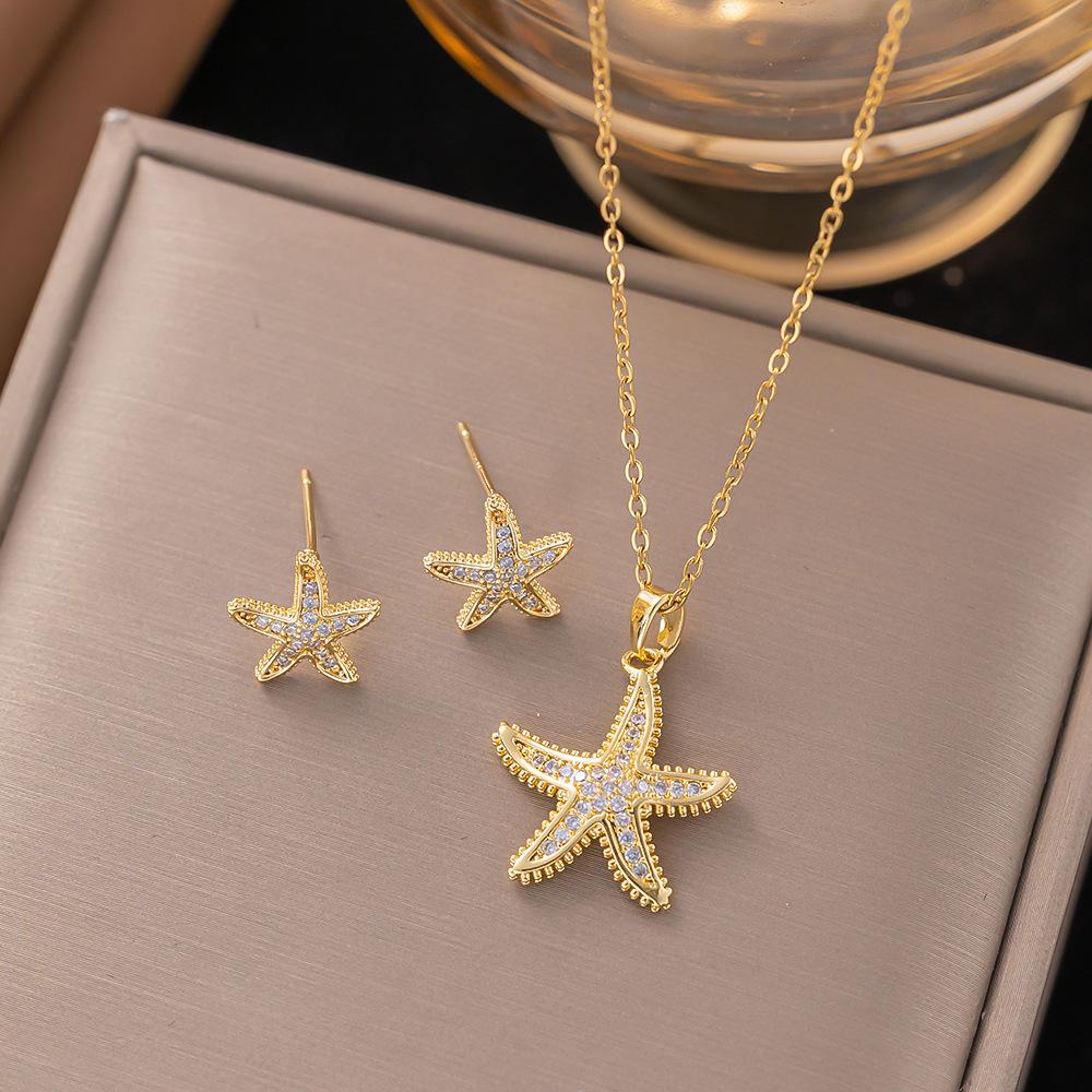 DIEYURO 316L Stainless Steel Golden Inlaid Zircon Starfish Ocean Style 2pc Necklace Earrings Set Lady Fashion Waterproof Jewelry