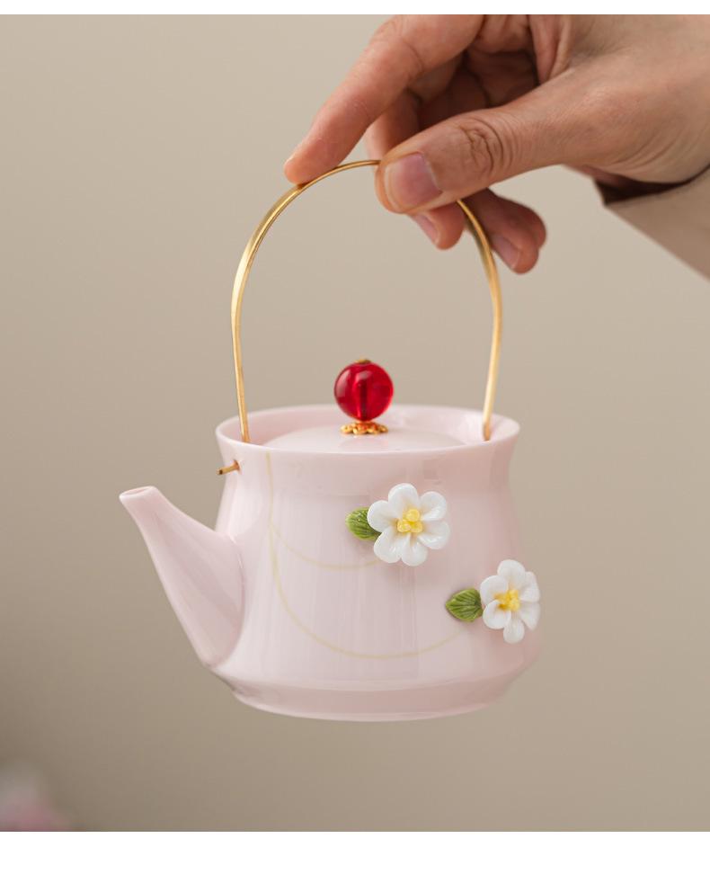 Women's Pink Ceramic Gongfu Tea Set with Teacup, Saucer, and Floral Handle Pot