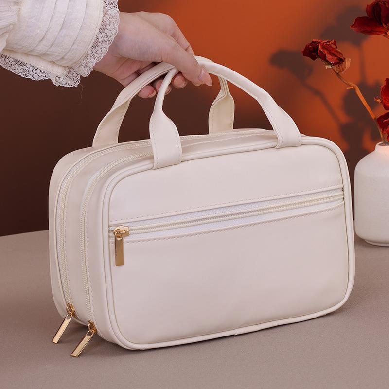 Double-layer portable cosmetic bag, large-capacity high-end women's portable niche~~ Cosmetics storage bag, starting from one approval.