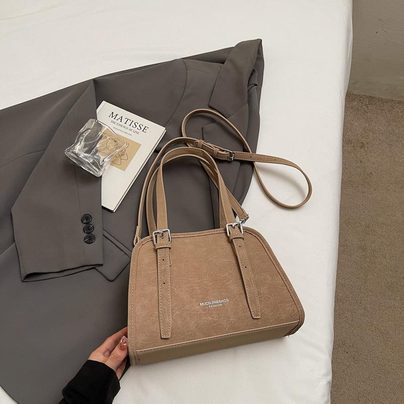 Korean version of high-value niche shoulder bag 2025 autumn new solid color fashion trend glossy underarm handbag women