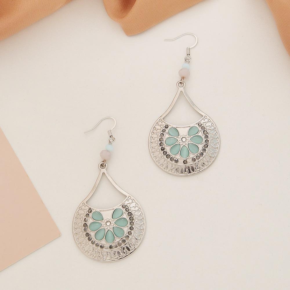 

Vintage-Style Teardrop Earrings: Alloy with Cat s Eye and Hollow Design for Women