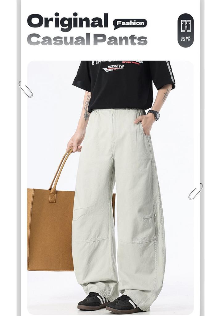 Spring and summer new European and American retro splicing ivory apricot scimitar loose straight casual pants men's pants