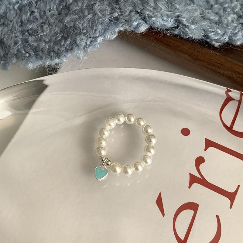 

Stylish Korean Heart-shaped Pearl Ring For Women With Elastic String Design 2023 J3919