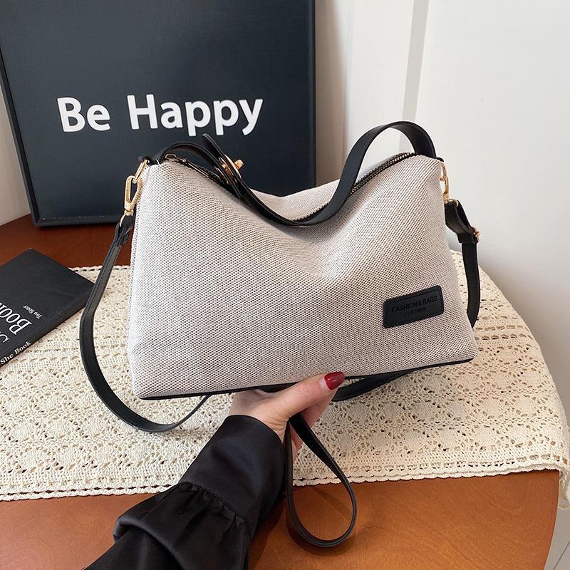 Niche design bag women's bag large capacity messenger bag knitted cloth shoulder armpit bag