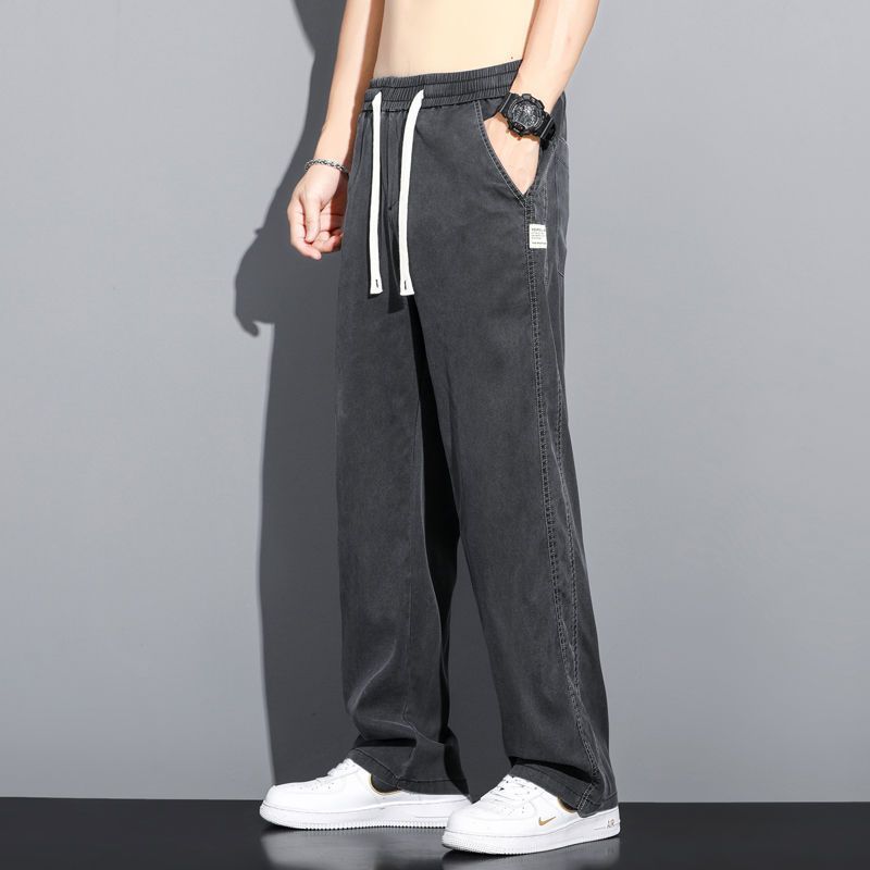 

Летняя мягкая лиоцелловая ткань Мужские джинсы Тонкие Свободные Прямые брюки Эластичная талия на кулиске Корейские повседневные брюки Большой размер M-5X XXXL чёрный