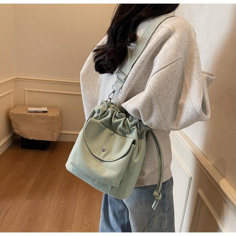 Canvas Bag Women's Spring and Summer New Niche Drawstring Shoulder Messenger Bag Pleated Bucket Bag