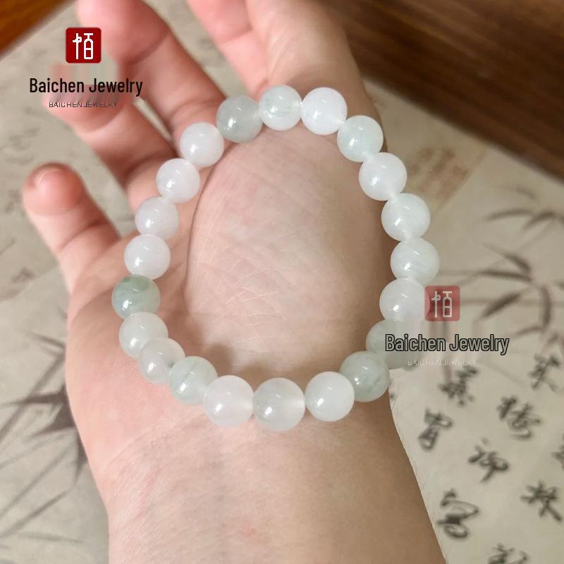 Golden Silk Jade Bracelet: Women's Xinjiang Tianshan Green Jade with Floating Flower Design and Barrel Beads.