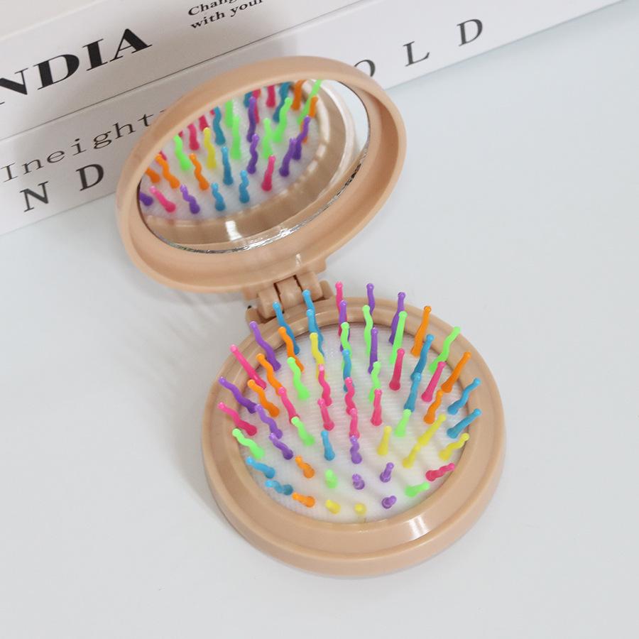 Kompakter Klappkamm & Schminkspiegel mit Airbag-Polster für Kopfmassage