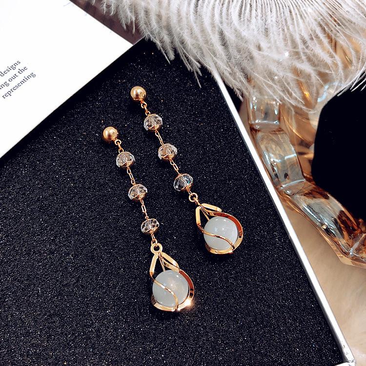 

Длинные серьги с опалом и кристаллами от австрийской личности. Серьги-иглы из серебра 925 пробы. Простые серьги-кисточки.