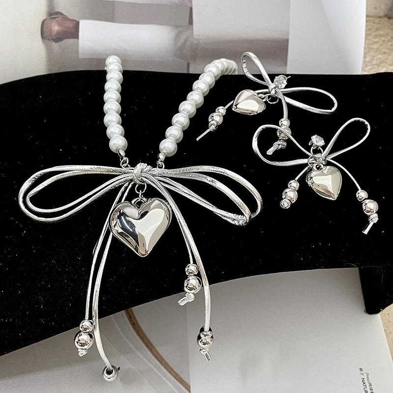 Love pendant collarbone chain pearl bead leather bow tassel necklace niche high-end necklace