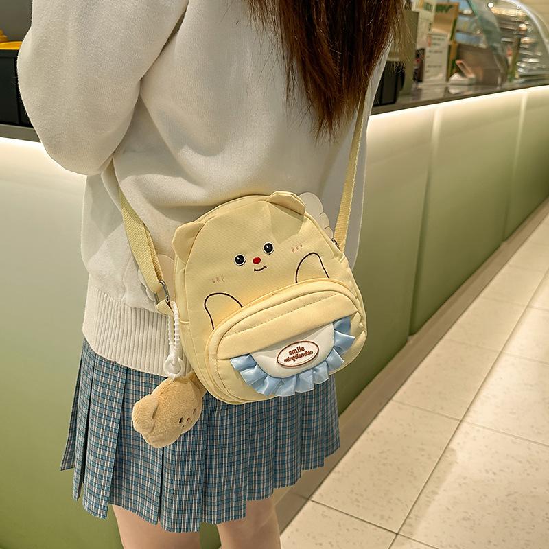 

Cute little yellow bear nylon messenger mobile phone bag ins new girl heart soft girl student versatile messenger small round bag bag [excluding pendant]