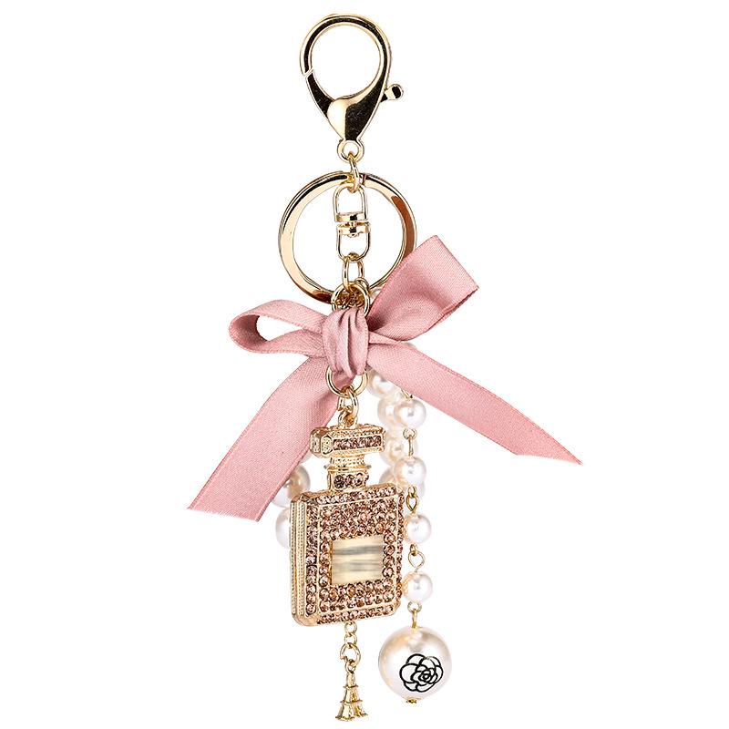 Korean-Style Handmade Rhinestone Perfume Bottle Keychain with Bow and Pearl Charm