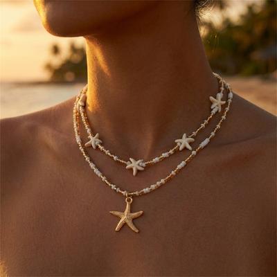 Zierliche Muschel Seestern Reiskorn Perlen Anhänger Halskette für Damen Boho Seestern Mehrschichtig Schlüsselbein Kette Strandparty Schmuck Geschenk