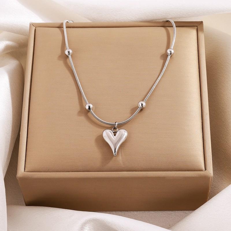 Elegant Titanium Heart Necklace - Light Luxury Women's Stainless Steel Jewelry, European & American Niche Design.