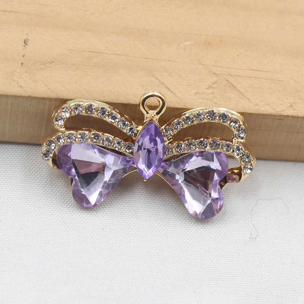 

Factory direct sales of 4 pieces of 18 * 35mm bow glass rhinestone pendant with circle, flat bottomed DIY clothing necklace pend
