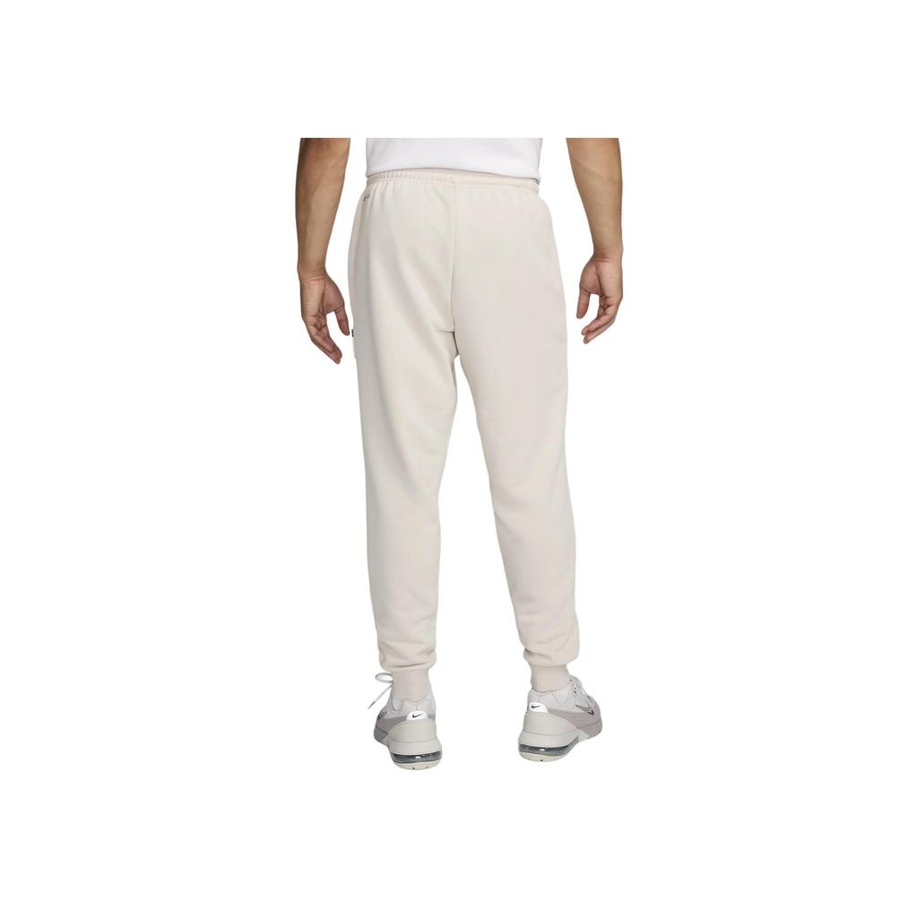 Nike Liverpool Dri-Fit SS24 F.C.. Spodnie męskie Standard Issue Logo Fashion Tapered Casual Pants Beżowe FQ3077-104