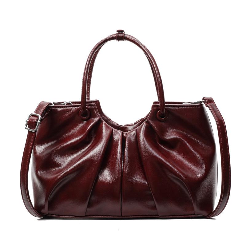 Korean version of foreign style niche design pleated handbag bag women's versatile foreign style advanced sense oil wax leather commuter messenger bag