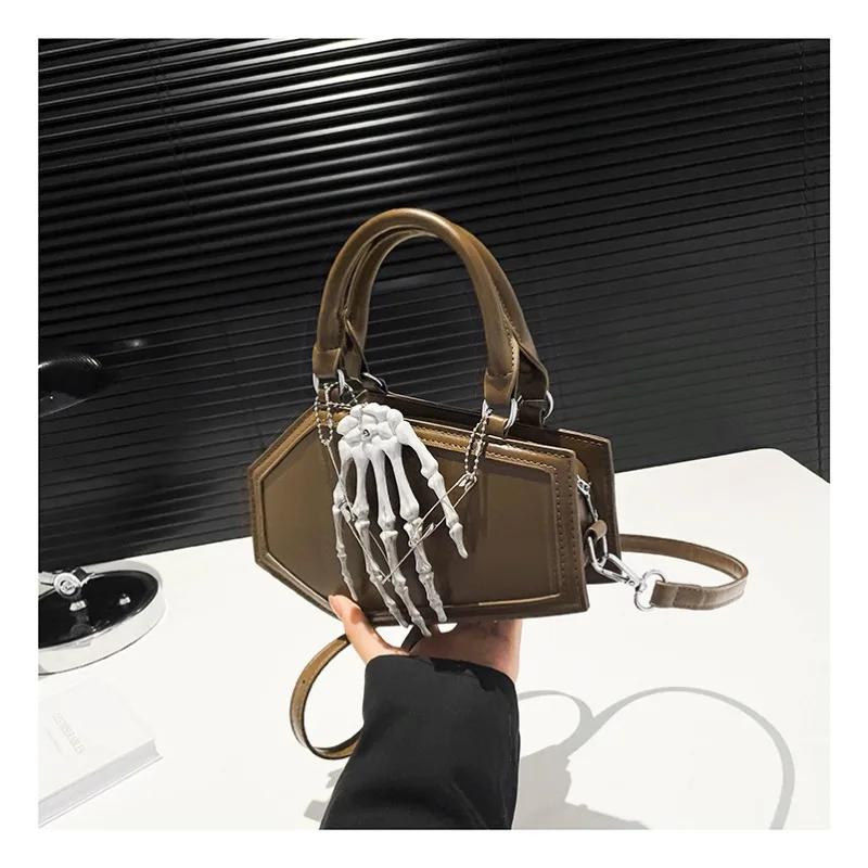 Autumn and winter new popular solid color leather punk style hand bone decoration portable fashion trend shoulder bag