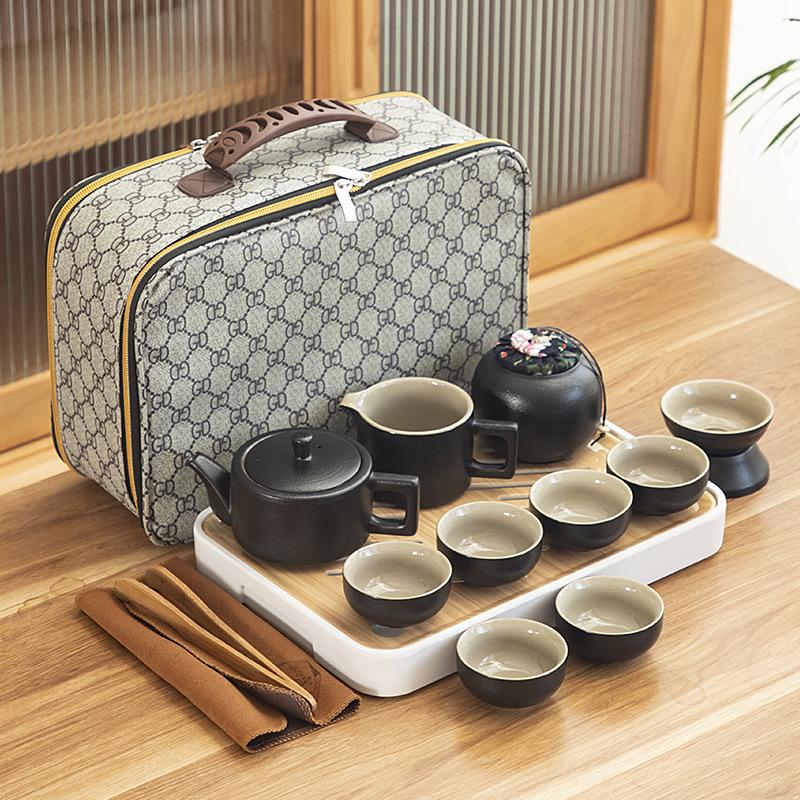 Black pottery travel kung fu tea set portable business gift set creative ceramic cooling pot set