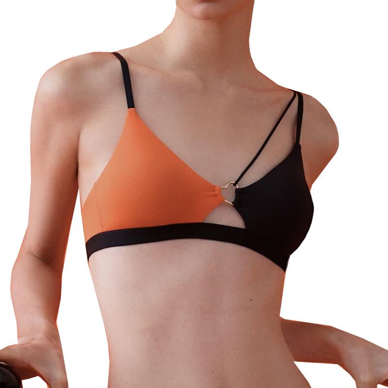 "Top de ioga fitness com decote profundo e cores contrastantes, com bojo e costas abertas"