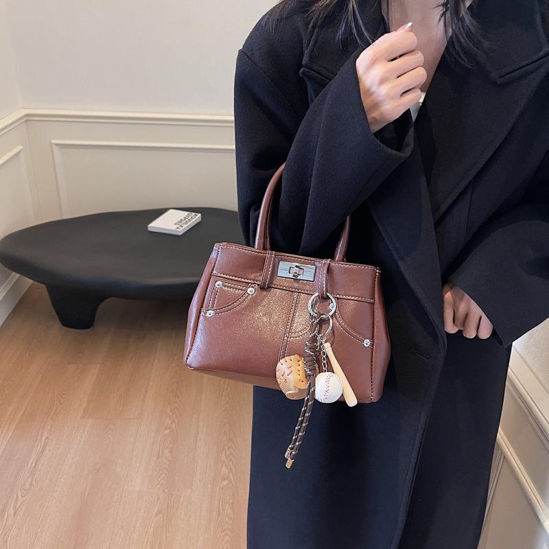 

New bag women s 2025 bucket bag autumn and winter niche design retro shoulder crossbody women s handbag 24*10*15 темно-коричневого кольору