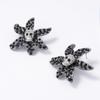 European and American personality trends niche dark alloy full diamond skull flower stud earrings exquisite light luxury women's earrings
