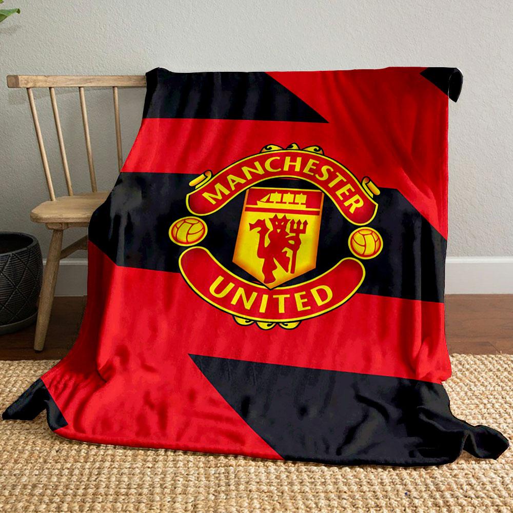 Diagonal red and black zigzag pattern with a central Manchester United logo. for all seasons blanket lunch break throw gift