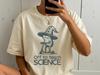 Off To Teach Science Witch Frog Halloween Tee — Funny Science Teacher Gift, Back To School, Quirky Frog Illustration