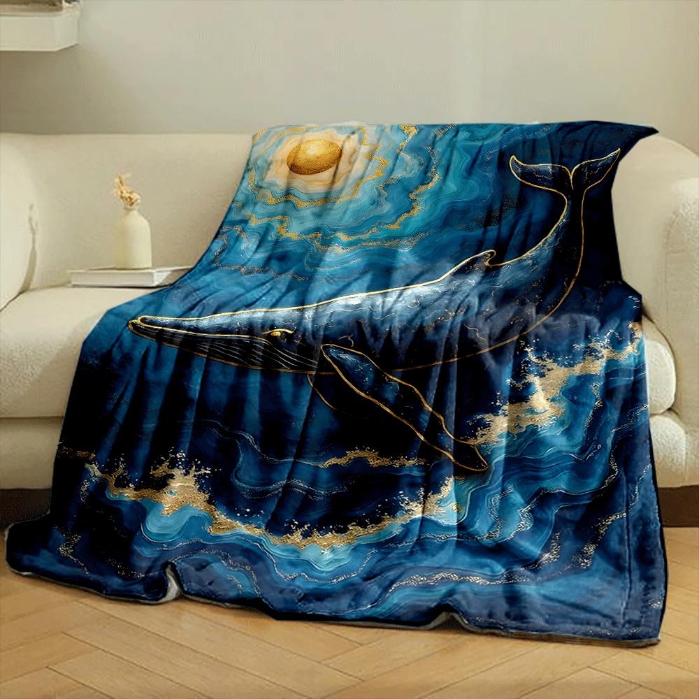A golden-accented whale swimming in swirling blue waves under a gold sun. for all seasons blanket lunch break throw gift