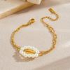 Gold Tone Paperclip Chain Bracelet with Pearl Flower Charm