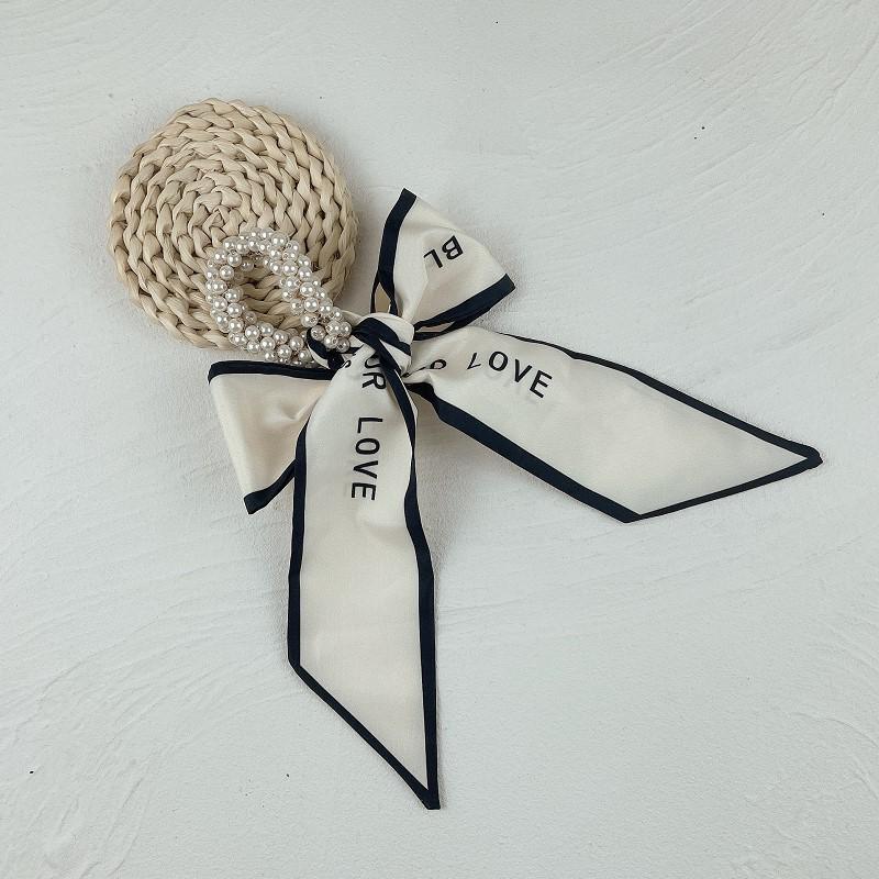 

Лента-бантик для волос с жемчугом – стильный, высокоэластичный аксессуар для волос