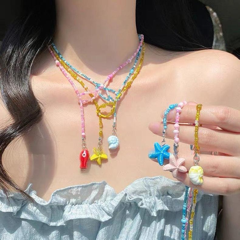 

Glass bead ceramic starfish conch pendant necklace versatile vacation style collarbone chain niche fashion high-end jewelry