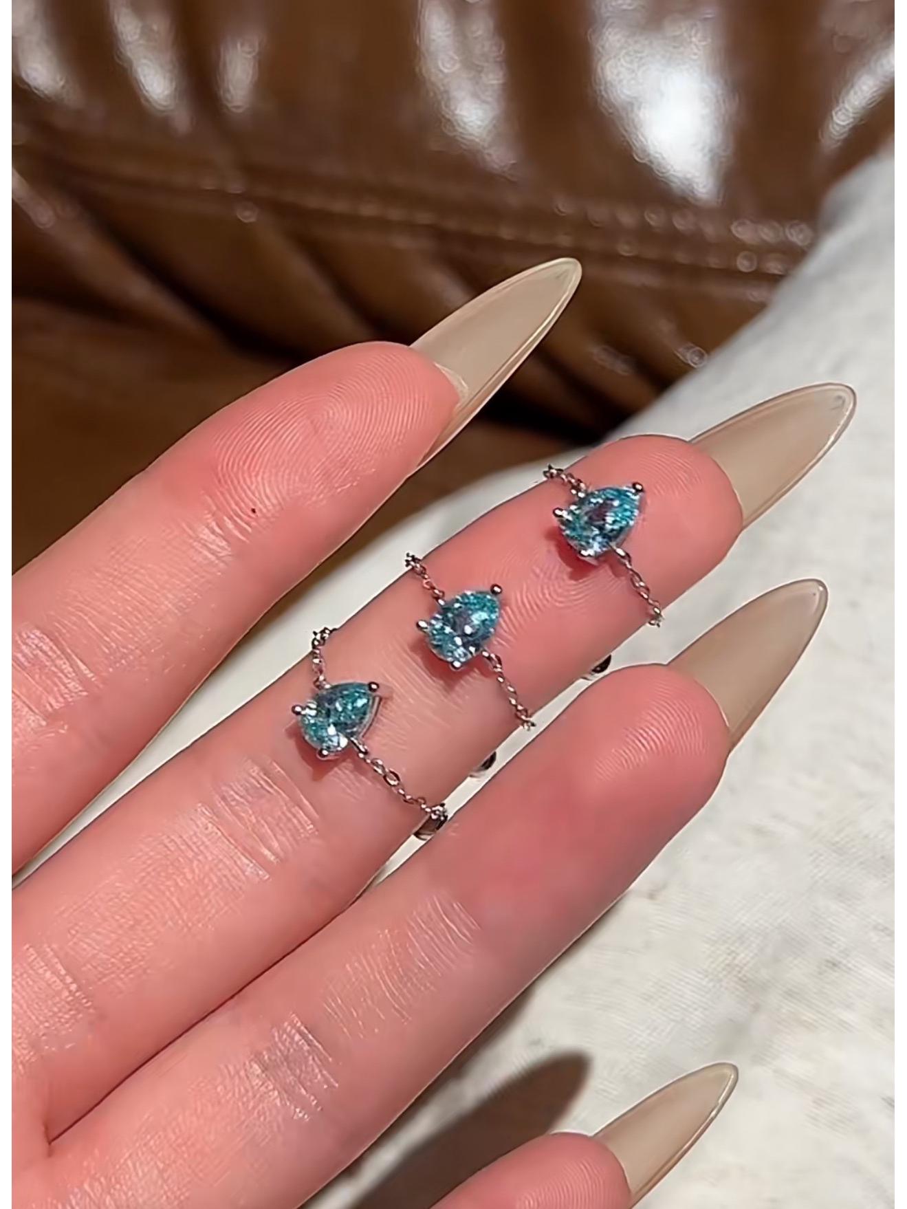 

S925 Sterling Silver Teardrop Zircon Ring with Cool-Toned Design, Exquisite Chain, and Adjustable Fit. Adjustable