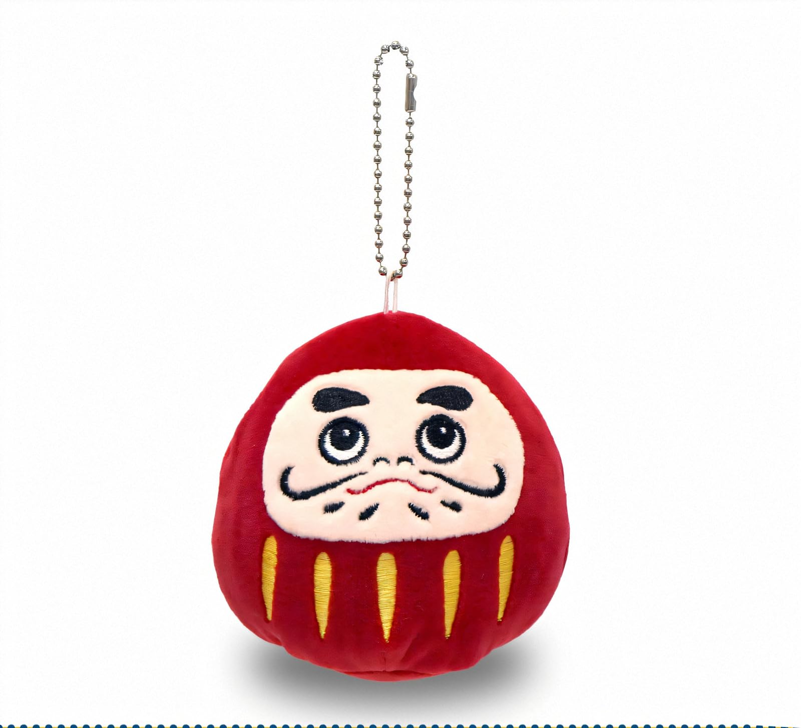 

Shinada holds a Daruma doll