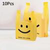 Gelbes Smiley Einkaufstaschen Robuste Plastik Tragetaschen mit minimalistischem Design Ideal für Firmen-, Event- und Mode-Einzelhandelsverpackung Geschenktüten