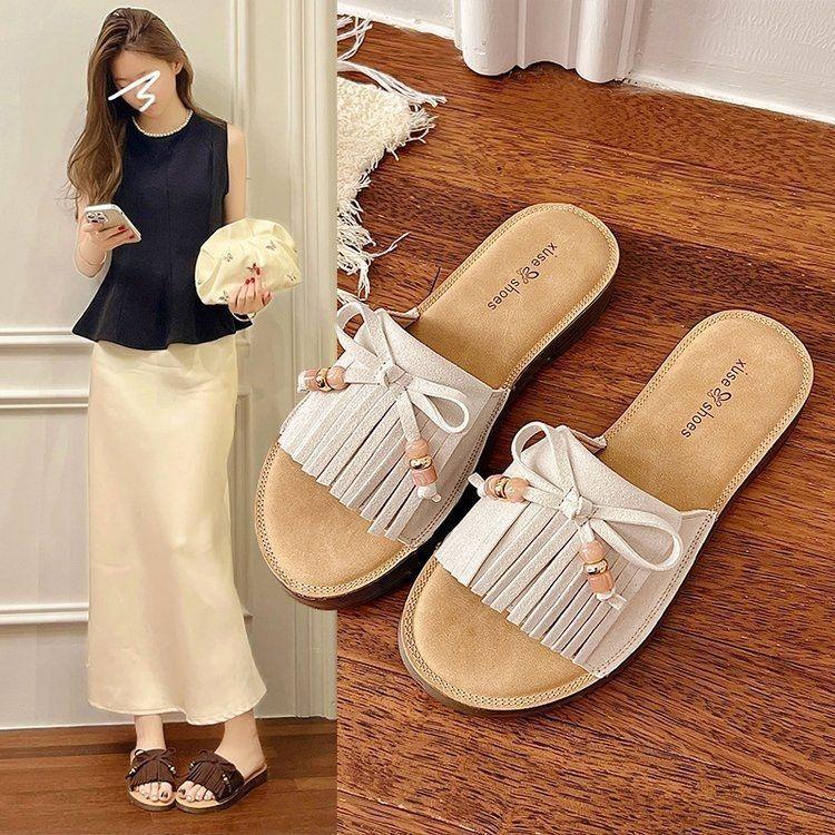 Holiday versatile one-word drag women wear 2025 summer fashion Internet celebrity seaside beach flat bottom non-slip cool slippers women