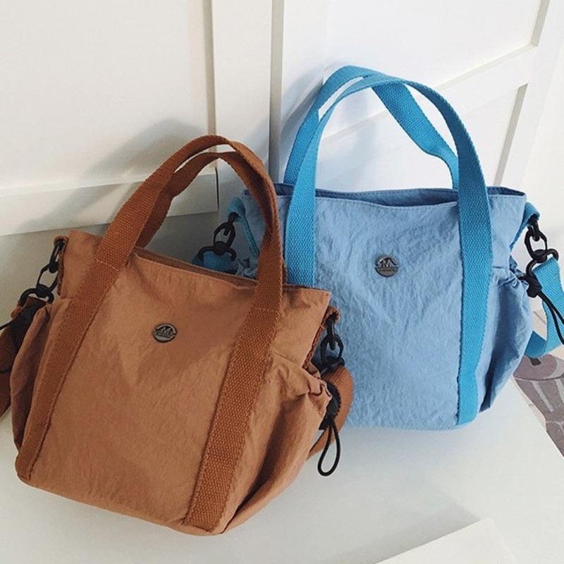 Frühlings- und Sommer-neue einseitige Umhänge-Damenhandtasche ist frisch und schlicht, ein Muss für den täglichen Weg zur Arbeit