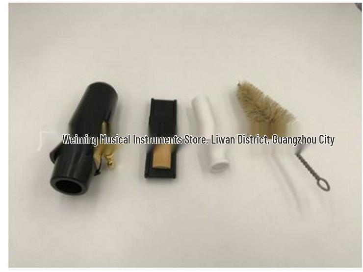 

Saxophone Mouthpiece Set with Cap, Ligature, Reeds, Cork Grease, Reed Clamp, and Cleaning Brush. Tenor