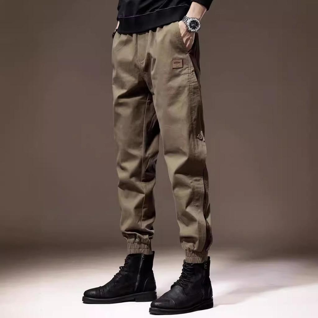 Męskie spodnie cargo z elastycznym pasem i wieloma wiązaniami, luźne, z wieloma kieszeniami i prostymi nogawkami, modne spodnie ogrodniczki