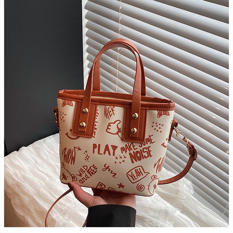 Contrasting color big bag women's 2025 autumn and winter new cute cartoon printed shoulder bag versatile trendy tote bag