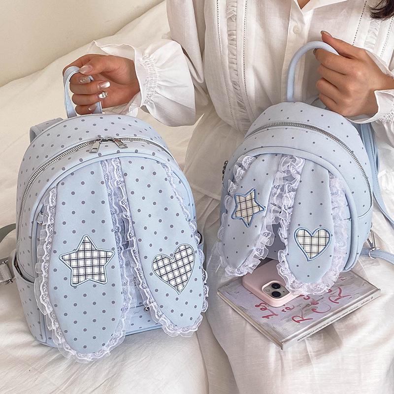 Schoolbag handsome rice family Korean simple foreign style polka dot love rabbit ear backpack 1011 spring new commuter student backpack