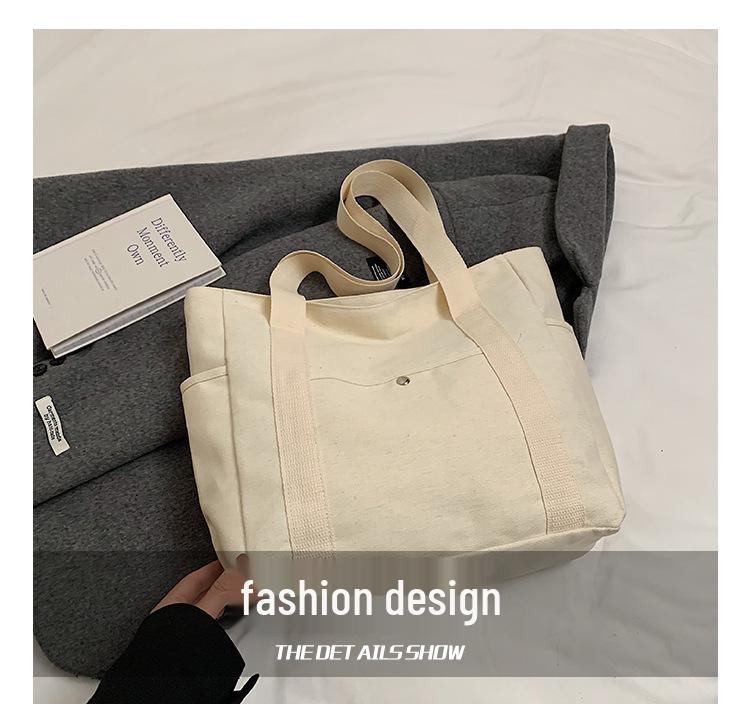 Versatile Literary Canvas Tote: Large Capacity Shoulder Bag for Work & Commute