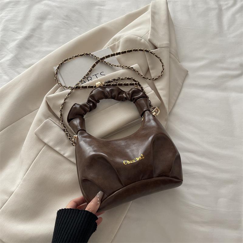 

Niche soft leather pleated portable dumpling bag women s new simple solid color casual chain crossbody cloud bag коричневый