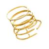 Gold and Stainless Steel Bracelet Set with Diamond-Studded Nails, Star Accents, and Four-Leaf Clover Bangles.